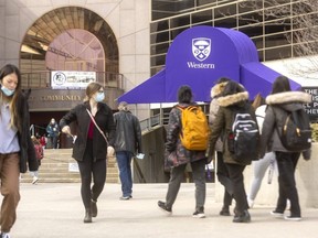 Western University students walk on campus. (Mike Hensen/The London Free Press)