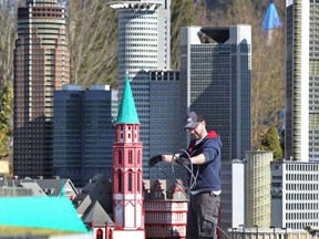 A technician works inside a reconstruction of the city of Frankfurt am Main made of Lego bricks on March 12, 2014 at the Legoland theme park near Guenzburg, Germany.