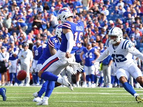 Buffalo Bills punter Matt Araiza (19) makes contact with the ball against the Indianapolis Colts at Highmark Stadium.