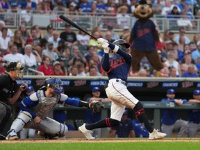 Twins batter Nick Gordon hits a three-run home run during the fourth inning against the Blue Jays at Target Field in Minneapolis, Friday, Aug. 5, 2022.