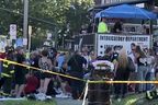 Emergency responders attend the scene where a car was driven into a crowd during a fundraiser for the families of Nescopeck fire victims at the Toxicology Department bar in Berwick, Pennsylvania August 13, 2022, in a still from a video. 