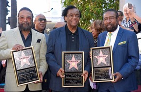 Songwriters (from left to right) Eddie Holland Lamont Dozier and Brian Holland receive a star for Holland-Dozier-Holland on the Hollywood Walk of Fame in Los Angeles, Calif., Feb. 13, 2015.
