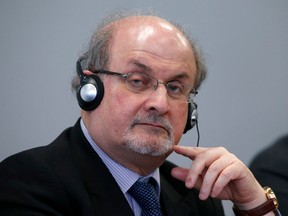 Author Salman Rushdie listens during the opening news conference of the Frankfurt book fair on October 13, 2015.