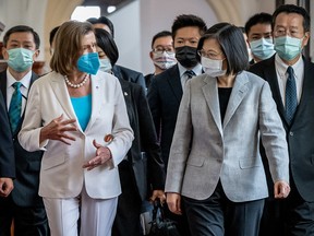 Speaker of the U.S. House of Representatives Nancy Pelosi (D-CA), centre left, speaks Taiwan’s President Tsai Ing-wen, centre right, after arriving at the president’s office on August 03, 2022 in Taipei, Taiwan.