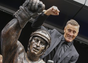 Toronto Maple Leaf legend Borje Salming with his Legends Row statue outside Scotiabank Arena on September 12, 2015.