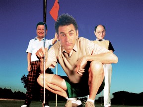 Low angle view of an elderly man squatting holding a golf club with two elderly women standing behind him