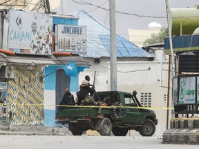 Somali security officers are seen at a section of Hotel Hayat, the scene of an al Qaeda-linked al Shabaab group militant attack in Mogadishu, Somalia Aug. 20, 2022.