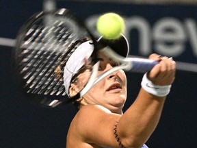 Bianca Andreescu (CAN) plays a shot against Daria Kasatkina (RUS) at Sobeys Stadium on Tuesday night.