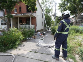 Ontario Fire Marshal Investigator Jim Kettles inspects the exterior of a home where a fatal two-alarm fire occurred on Riverdale Avenue around 12:45 a.m. Wednesday. An elderly man was found dead on the second floor of a cluttered semi-detached house. Wednesday, August 3, 2022.