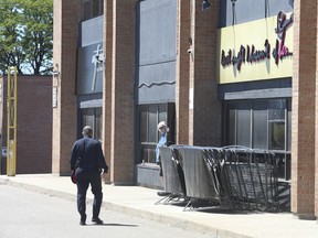 Peel Regional Police Insp. Raj Biring speaks to the day manager of HER adult entertainment club at1325 Eglinton Avenue East, Mississauga at Dixie Rd. on Friday, Aug. 12, 2022.