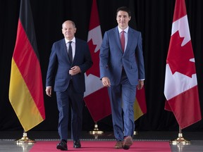 Prime Minister Justin Trudeau greets German Chancellor Olaf Scholz in Montreal on Monday, August 22, 2022. THE CANADIAN PRESS/Paul Chiasson