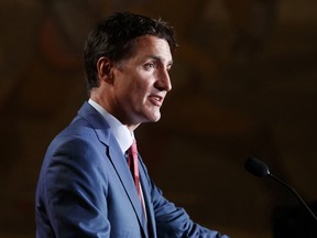 Canada's Prime Minister Justin Trudeau speaks at a welcome dinner for the German Chancellor Olaf Scholz at the Royal Ontario Museum in Toronto on Aug. 22, 2022.