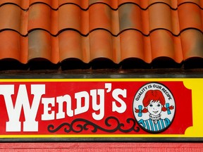A Wendy's sign and logo are shown at one of the company's restaurant in Encinitas, California on May 10, 2016 .