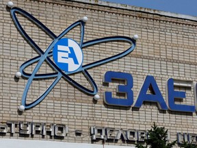 The logo of the Zaporizhzhia Nuclear Power Plant is seen on a wall of a culture house during the Ukraine-Russia conflict in the Russian-controlled city of Enerhodar in Zaporizhzhia region, Ukraine, Monday, Aug. 22, 2022.