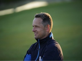 In this file photo taken on September 25, 2018 Europe's English vice-captain Luke Donald poses after a group photograph ahead of the 42nd Ryder Cup at Le Golf National Course at Saint-Quentin-en-Yvelines, south-west of Paris.