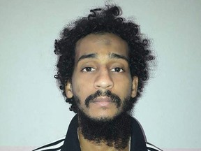 A handout file photo provided by the Syrian Democratic Forces (SDF) on February 10, 2018 shows captured British Islamic State (IS) group fighter El Shafee Elsheikh, posing for a mugshot in an undisclosed location. - Elsheikh, 34, a member of the notorious IS kidnap-and-murder cell known as the "Beatles" was sentenced to life in prison by a US court on August 19, 2022, for the deaths of four US hostages in Syria. E
