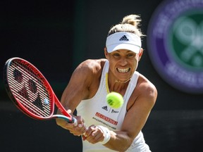 In this file photograph taken on July 1, 2022, Germany's Angelique Kerber returns the ball to Belgium's Elise Mertens during their women's singles tennis match on the fifth day of the 2022 Wimbledon Championships at The All England Tennis Club in Wimbledon, southwest London.
