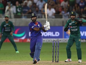 India's Hardik Pandya hits a boundary to win the Asia Cup Twenty20 international cricket Group A match between India and Pakistan at the Dubai International Cricket Stadium in Dubai on August 28, 2022.