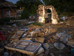 Vladimir, 66, stands next to the wreckage of his house after being bombed by Russians in Chernihiv, Ukraine, Monday, Aug. 29, 2022.