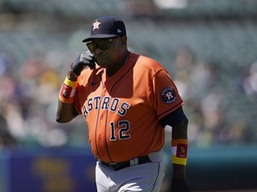 Houston Astros manager Dusty Baker Jr. walks toward the dugout after making a pitching change during the seventh inning of his team's baseball game against the Oakland Athletics in Oakland, Calif., Wednesday, July 27, 2022.