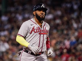 Aug 10, 2022; Boston, Massachusetts, USA; Atlanta Braves designated hitter Marcell Ozuna  hits a three run home run against the Boston Red Sox in the fourth inning at Fenway Park.