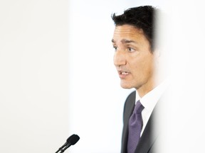 Prime Minister Justin Trudeau speaks at a media availability following a roundtable meeting that he and the Ahmed Hussen, Minister of Housing, Diversity and Inclusion had with local delegates at the Country Hills Library in Kitchener, Ont. on Aug. 30, 2022.