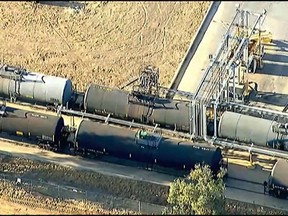 This image taken from video provided by ABC7 Los Angeles, shows the scene where a railroad tank car is leaking near Perris, Calif., Friday, Aug. 12, 2022.