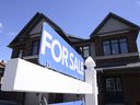 The Canadian Real Estate Association says home sales fell for the fifth consecutive month between June and July but this month's drop was the smallest of the five.  A new home is displayed for sale in a new housing development in Ottawa on Tuesday, July 14, 2020.