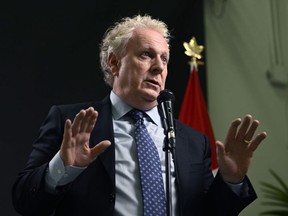 Conservative Leadership candidate Jean Charest answers questions from reporters after the third debate of the 2022 Conservative Party of Canada leadership race, in Ottawa, Wednesday, Aug. 3, 2022.