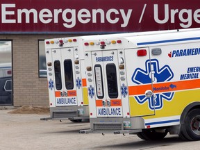 Ambulances sit outside St. Boniface Hospital in Winnipeg on Thurs., Oct. 29, 2020.