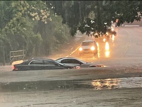 This handout photo provided by the Dallas Police Department on Aug. 22, 2022, shows vehicles sitting in flood waters along a street in Dallas, Texas.