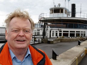 Toronto historian and former Sun columnist Mike Filey is pictured in a 2010 file photo in front of the then dry-docked Trillium ferry.