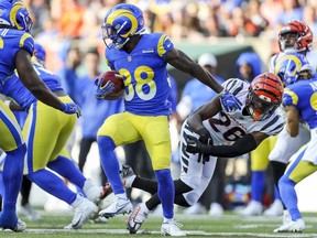 Aug 27, 2022; Cincinnati, Ohio, USA; Los Angeles Rams cornerback Duron Lowe (38) runs with the ball against Cincinnati Bengals safety Tycen Anderson (26) in the first half at Paycor Stadium.