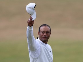 Golf - The 150th Open Championship - Old Course, St Andrews, Scotland, Britain - July 15, 2022 Tiger Woods of the U.S. acknowledges the fans after holing on the 18th and finishing his second round.