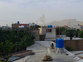 In this photograph taken on July 31, 2022, smoke rises from a house following a U.S. drone strike in the Sherpur area of Kabul.