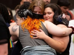 Abortion rights supporters react to the news that voters had rejected a state constitutional amendment that would have declared there is no right to abortion, during the Kansans for Constitutional Freedom election watch party in Overland Park, Kansas, U.S., Aug. 8, 2022.