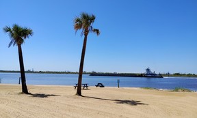 A barge cruises past the beach at L’Auberge Casino Resort along the Calcasieu River in Lake Charles, La. (Dave Pollard/Toronto Sun)