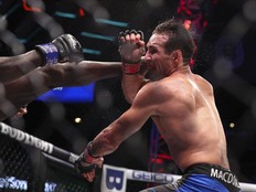 Canadian Rory (Red King) MacDonald absorbs a punch from Sweden's Sadibou Sy in their Professional Fighters League welterweight bout at the Overtime Elite Arena in Atlanta, Ga., in a Friday, July 1, 2022, handout photo. Dilano (The Postman) Taylor, a late replacement, knocked out Canadian welterweight Rory (Red King) MacDonald in the first round of their Professional Fighters League semifinal Saturday.