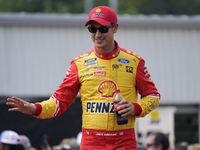Joey Logano greets fans during driver introductions prior to a NASCAR Cup Series auto race at Richmond Raceway, Sunday, Aug. 14, 2022, in Richmond, Va.