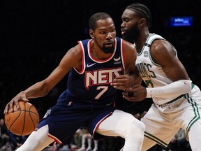 Brooklyn Nets forward Kevin Durant (7) drives against Boston Celtics guard Jaylen Brown, right, April 25, 2022, in New York.