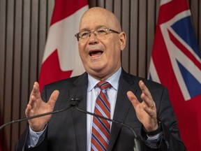 Minister of Municipal Affairs and Housing Steve Clark answers questions after an announcement in the Ontario Legislature, in Toronto, Monday, Dec. 7, 2020.