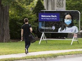 A student walks towards the Western University campus in London, Ont., on September 15, 2021.
