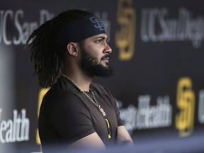 San Diego Padres' Fernando Tatis Jr. looks on from the dugout prior to the team's game against the Philadelphia Phillies on June 25, 2022, in San Diego.
