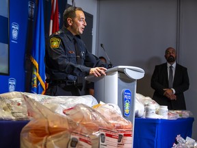 Deputy Chief Nick Milinovich addresses the media among a display of Illicit drugs after a seizure of over $12 million worth by Peel Regional Police during a press conference at Peel Regional Police Headquarters in Mississauga, Ont. on Tuesday August 30, 2022.