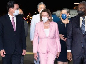 This handout picture taken and released by Taiwans Ministry of Foreign Affairs (MOFA) on August 2, 2022 shows Speaker of the US House of Representatives Nancy Pelosi being welcomed upon her arrival at Sungshan Airport in Taipei.
