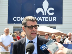 Conservative Party of Quebec Leader Éric Duhaime responds to reporters at his campaign launch rally, Sunday, August 28, 2022 in Quebec City.
