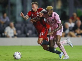 Aug 20, 2022; Fort Lauderdale, Florida, USA; Toronto FC forward Federico Bernardeschi (10) battle for possession against Inter Miami CF defender Damion Lowe (31) during the second half at DRV PNK Stadium.