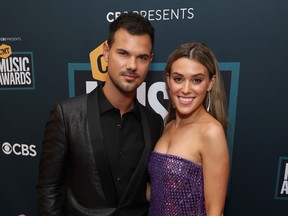Taylor Lautner and Taylor Dome are pictured at the 2022 CMT Music Awards.