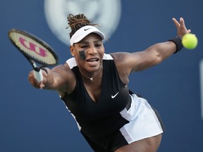 Serena Williams, of the USA, reaches for the ball against Belinda Bencic, of Switzerland, during the National Bank Open tennis tournament in Toronto on Wednesday, August 10, 2022.