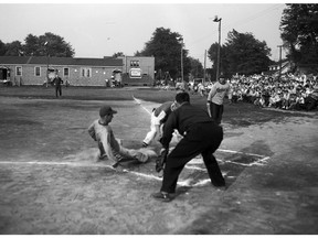 That’s Orval Tessier sliding into home during a Brookshell Champions game on July 30, 1953 in Cornwall, Ont. (Cornwall Standard-Freeholder files/Postmedia Network)